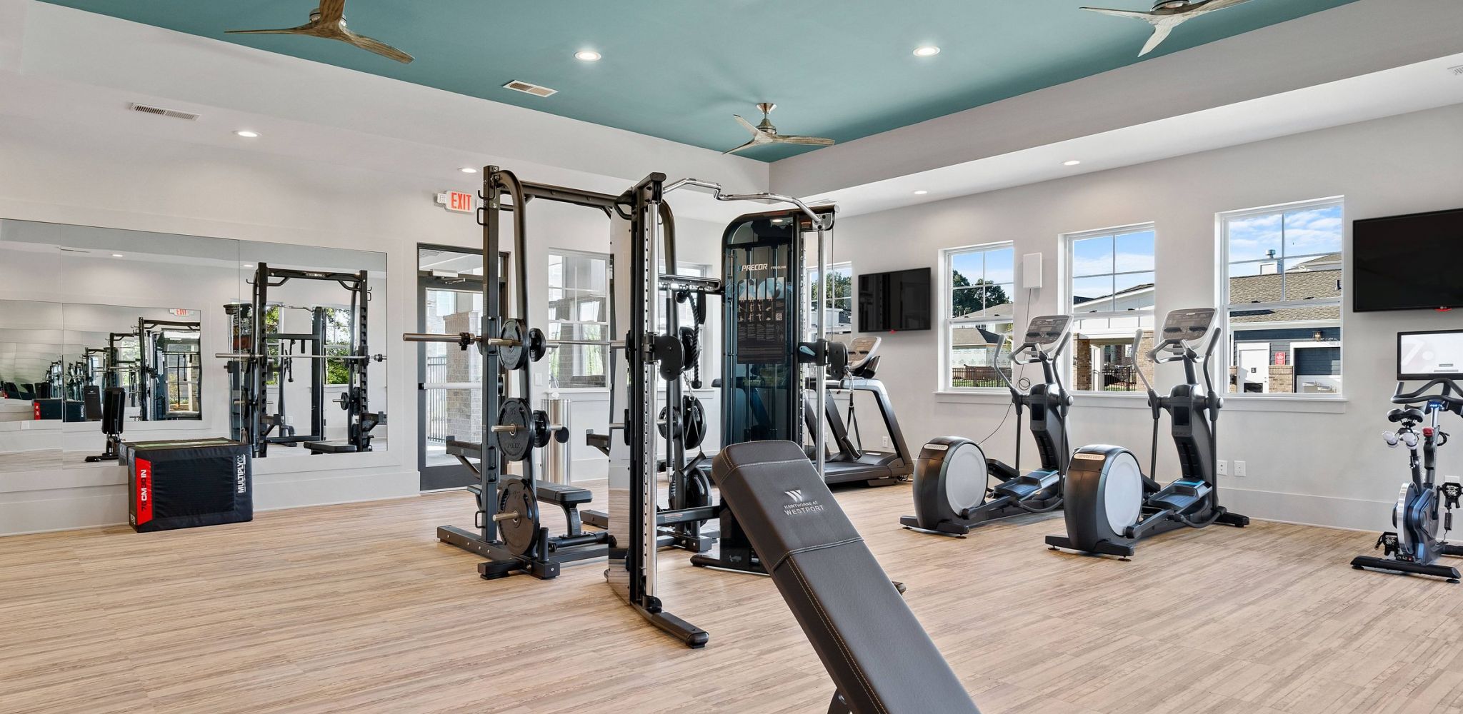 Hawthorne at Westport fitness center with cardio machines and weight racks