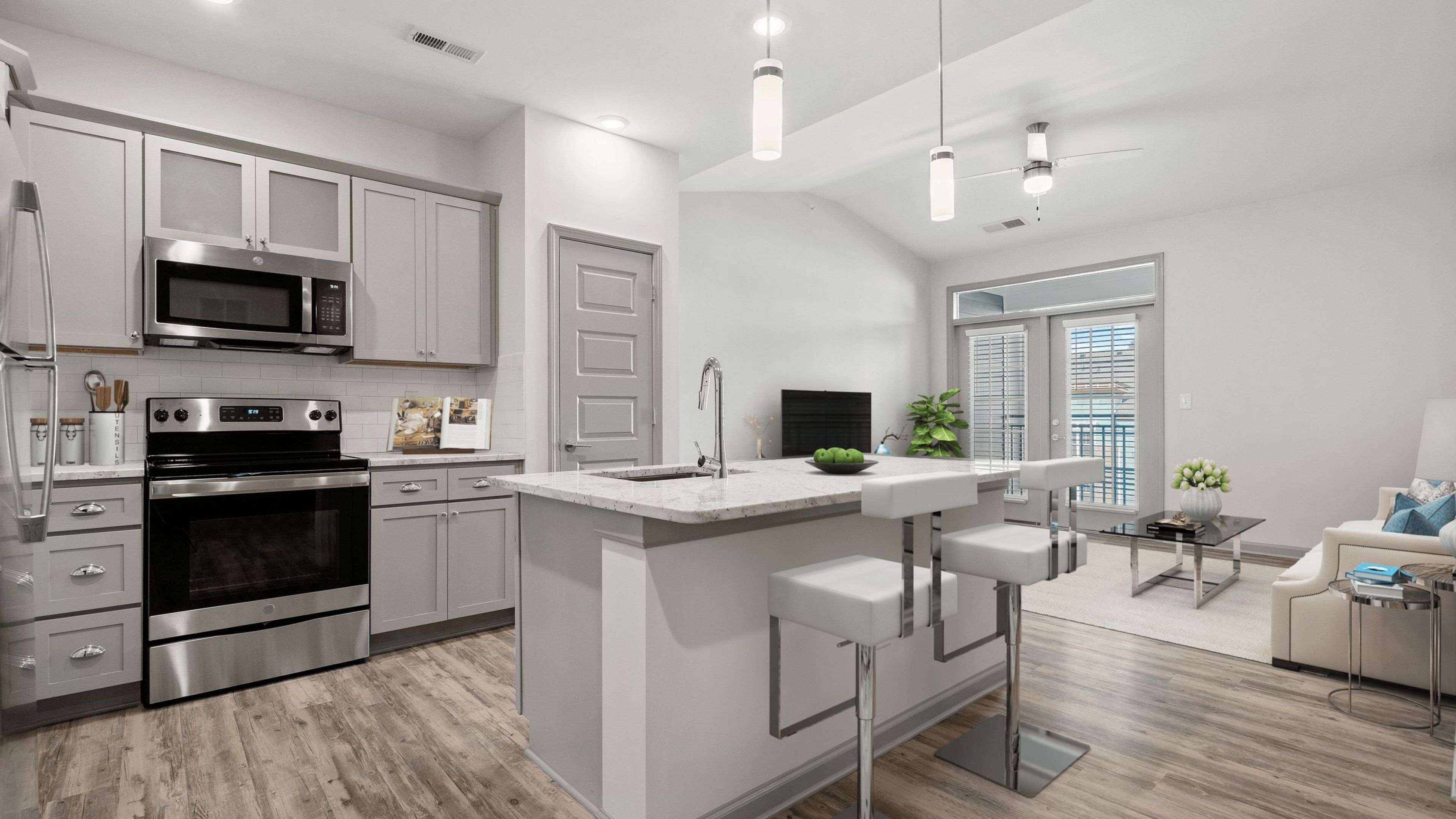 Hawthorne at Westport luxury Denver, NC apartment kitchen with stainless steel appliances and custom cabinetry